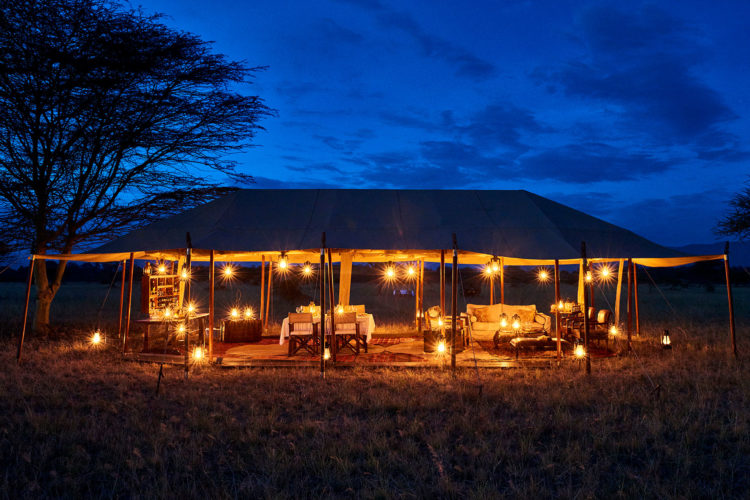 Legendary serengeti mobile camp, tent at night, mobile camping safari