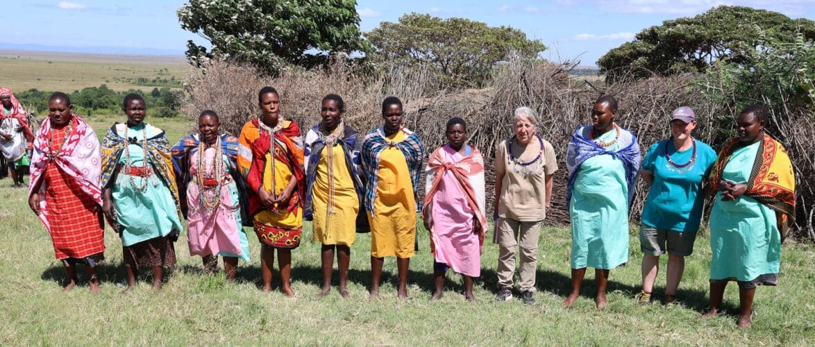 Rachel and Paddy holiday LGBTQIA+ Kenya Victoria Falls gay couple singing Kenyan women community