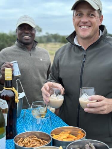 your safari guide is everything Sabi Sabi guide serving drinks DW trip 2023