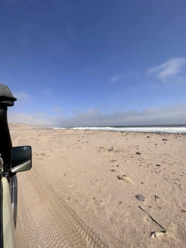 vehicle and endless beach skeleton coast national park namibia danica trip 2023