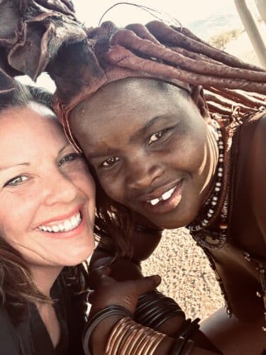 danica and himba woman Visiting a himba village from Hoanib Valley Camp Kaokoland with Natural Selection Travel Danica Wilson 2023