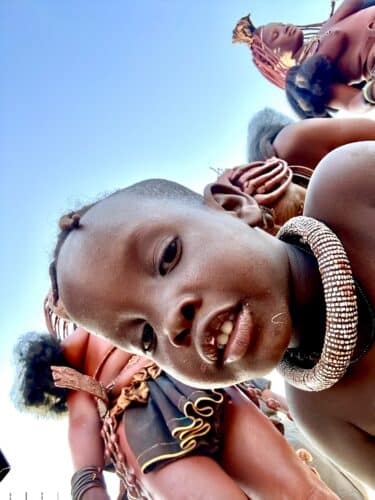 selfie of a himba child Visiting a himba village from Hoanib Valley Camp Kaokoland with Natural Selection Travel Danica Wilson 2023