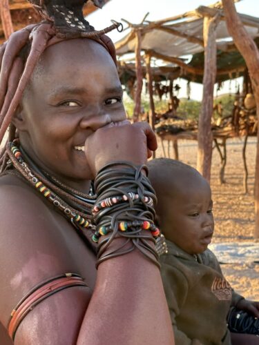 himba woman laughing Visiting a himba village from Hoanib Valley Camp Kaokoland with Natural Selection Travel Danica Wilson 2023