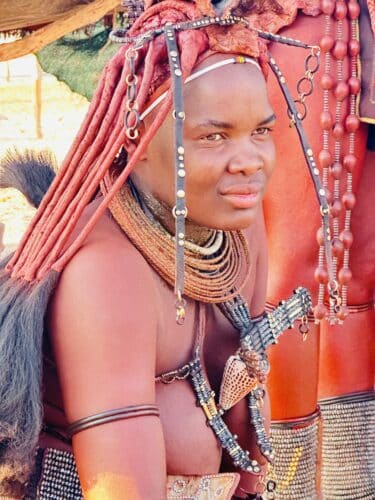 up close himba woman and her hair and body paint Visiting a himba village from Hoanib Valley Camp Kaokoland with Natural Selection Travel Danica Wilson 2023