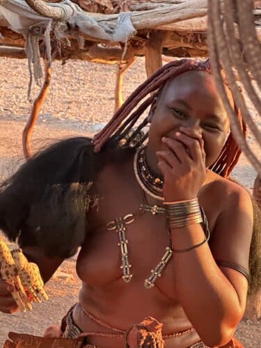 himba woman laughing Visiting a himba village from Hoanib Valley Camp Kaokoland with Natural Selection Travel Danica Wilson 2023