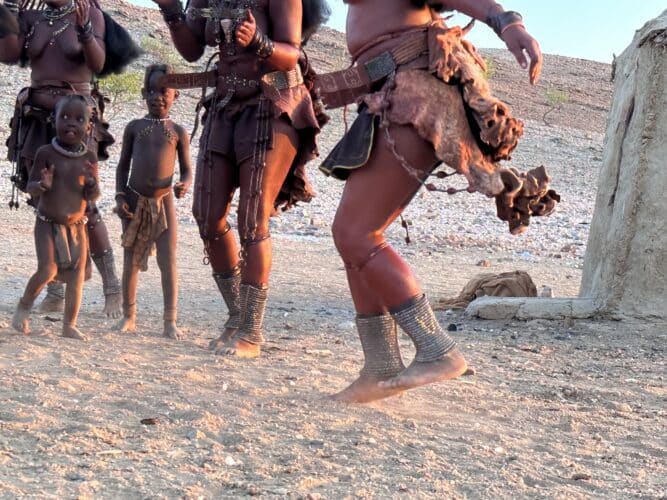Himba women's feet dancing Visiting a himba village from Hoanib Valley Camp Kaokoland with Natural Selection Travel Danica Wilson 2023